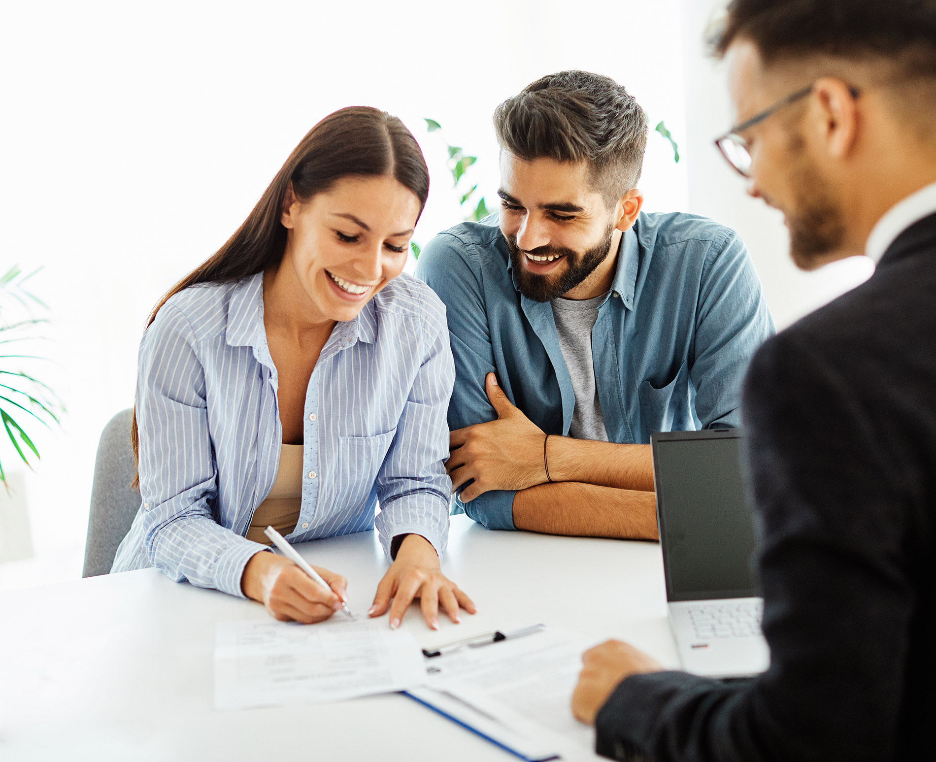 Real Estate Agent With Couple Closing A Deal